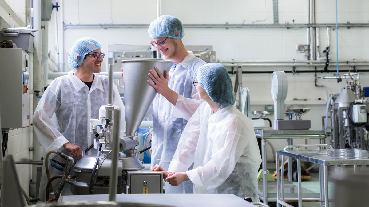 Three students in a laboratory