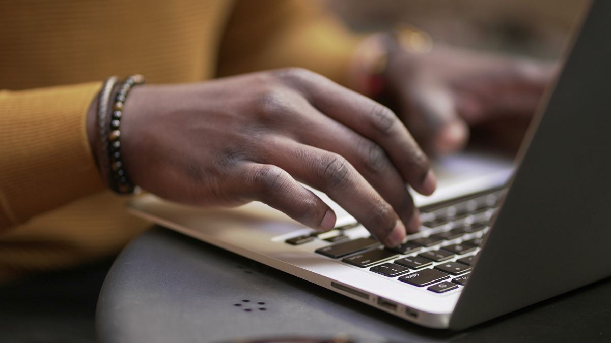  Close up of typing on laptop